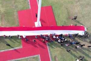 Rayakan HUT RI, Buruh Migran Siapkan Bendera Merah Putih Raksasa di Lapangan Pancasila