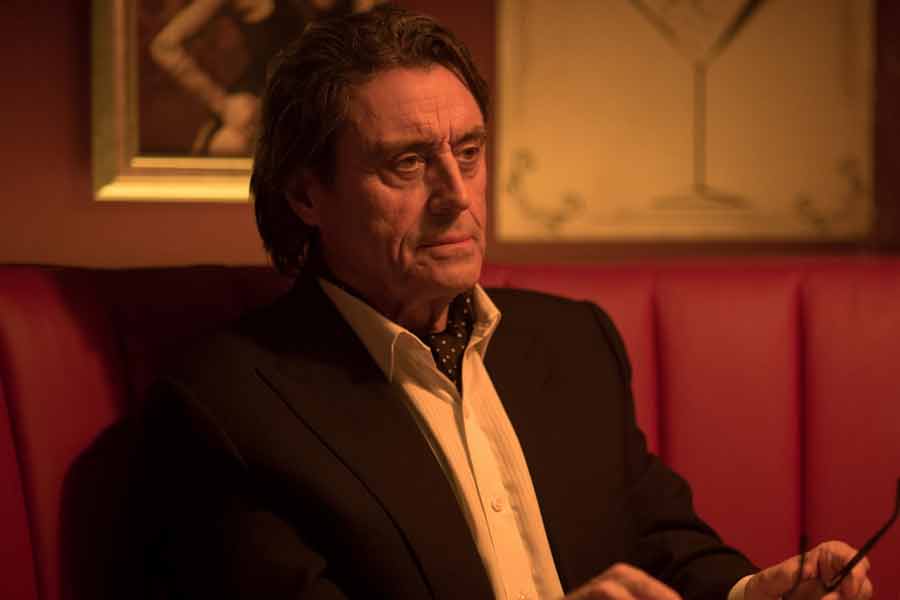 Ian McShane berperan sebagai Winston Scott dalam John Wick (2014)