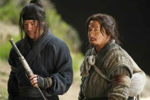 Jackie Chan dan Leehom Wang dalam Little Big Soldier (2010)